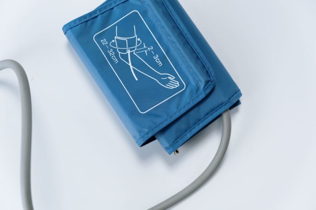 Blood pressure cuff with sizing guide on a white surface