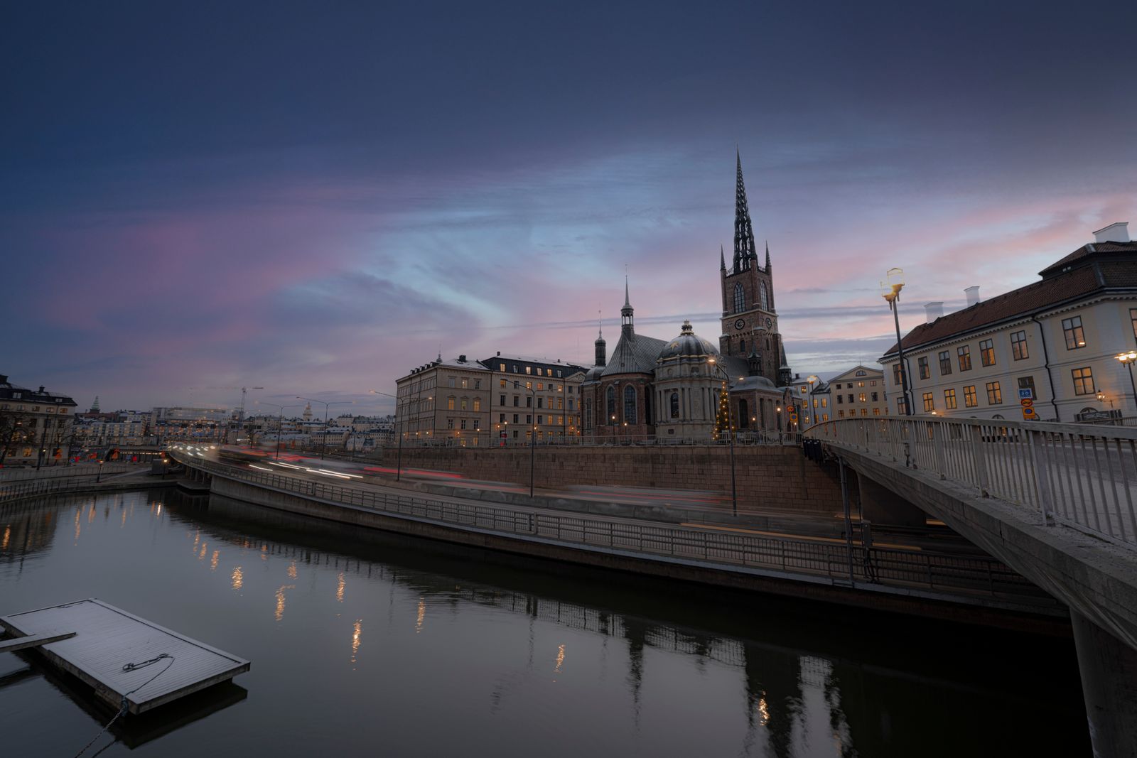Stockholm Sweden skyline with church spire at sunset