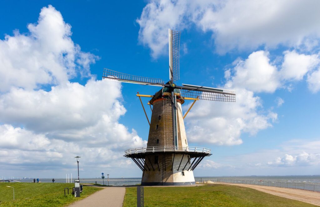 Traditional Dutch windmill beside water in the Netherlands