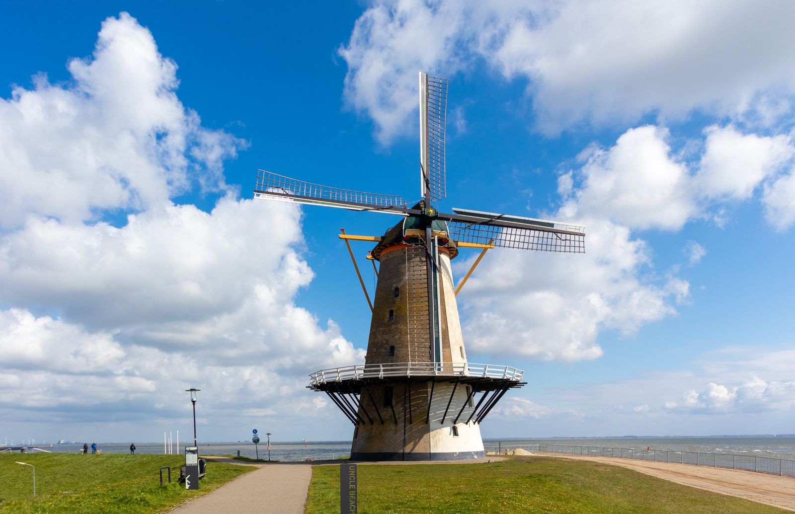 Traditional Dutch windmill beside water in the Netherlands