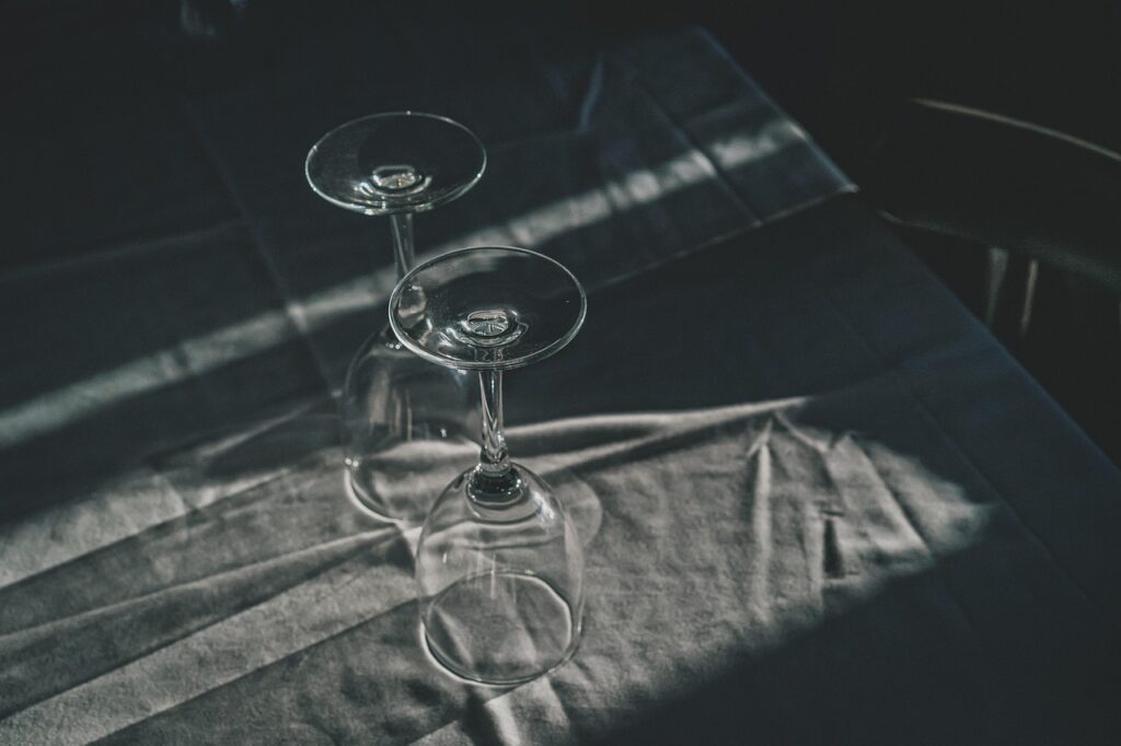 Empty wine glasses set on a table, a reminder to drink with caution