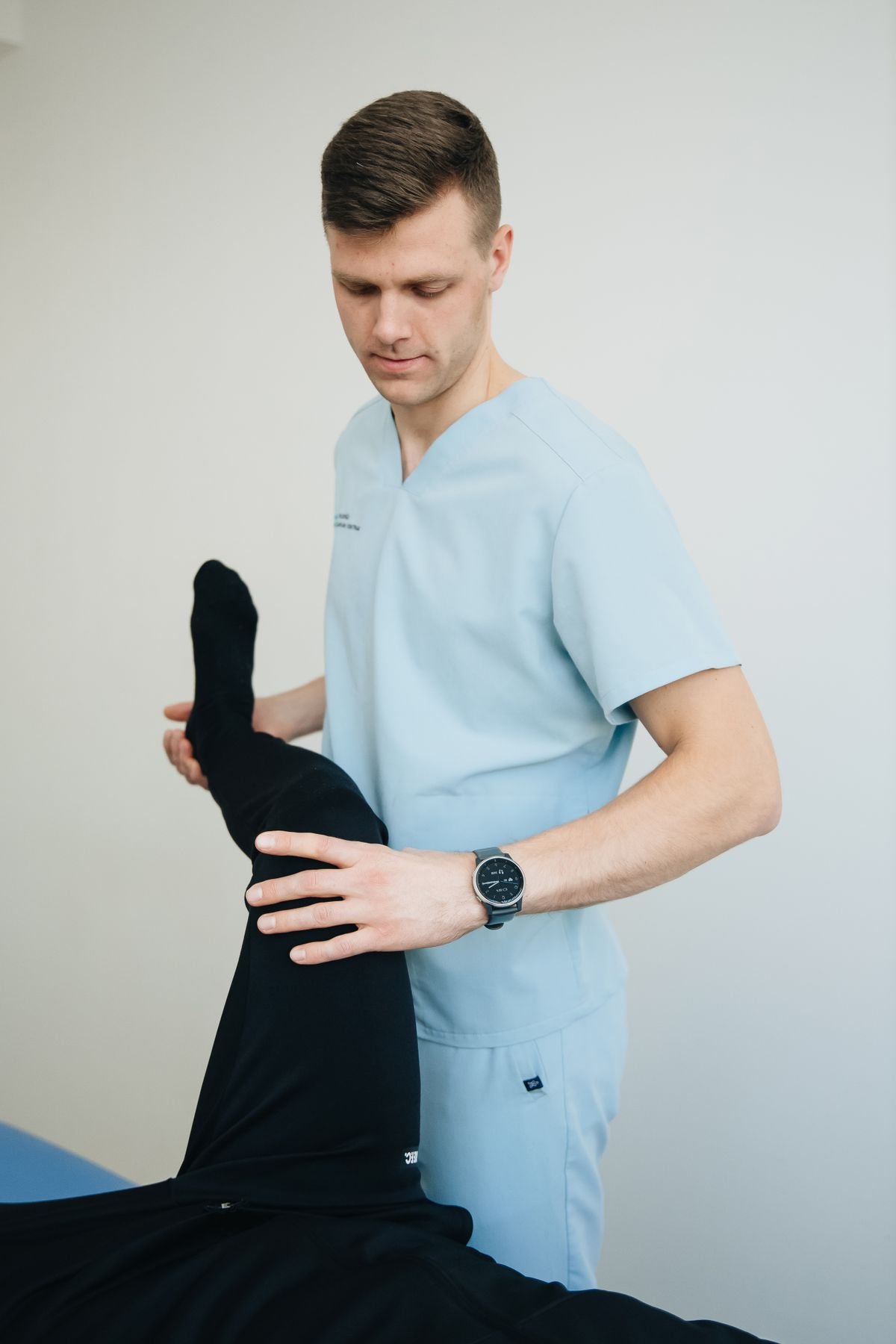 Physical therapist assessing hip pain before recommending CBD or other treatment