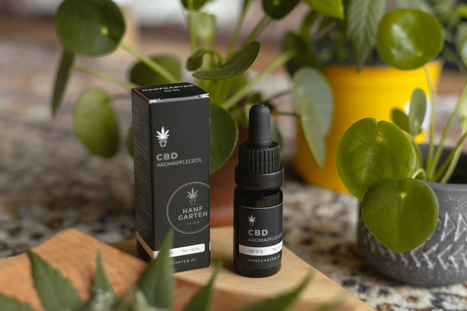 CBD oil dropper bottle used for lupus joint pain and inflammation management