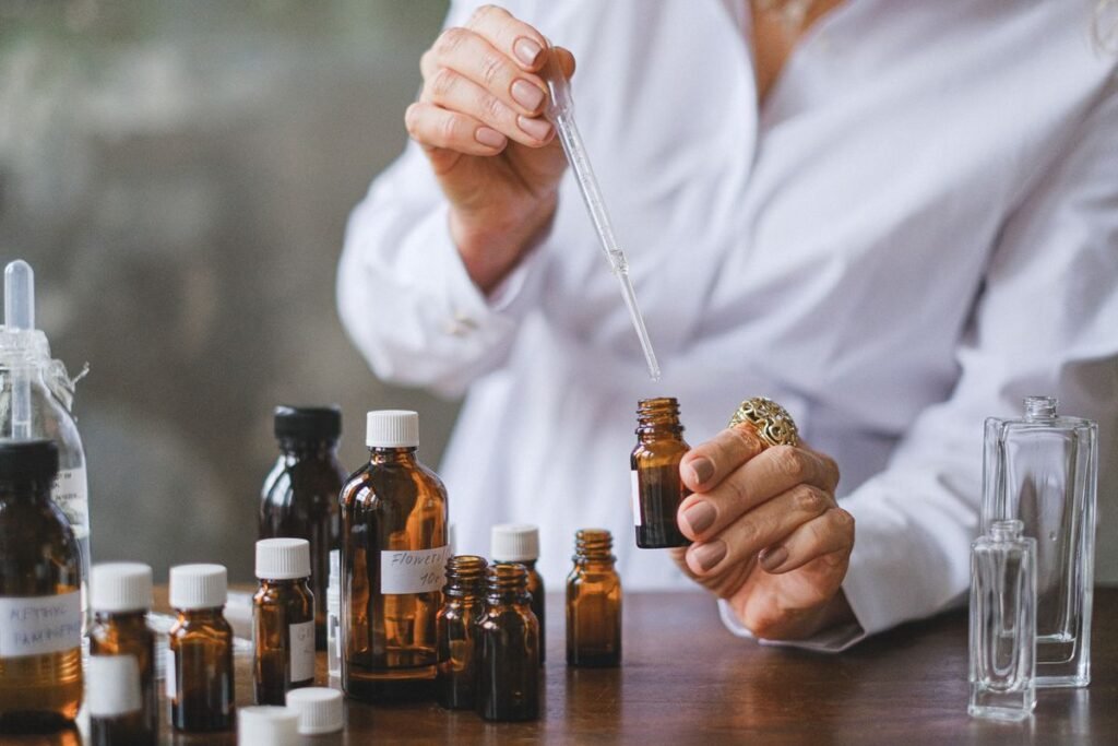 Hands using a dropper with amber CBD oil bottles on a table, third-party testing