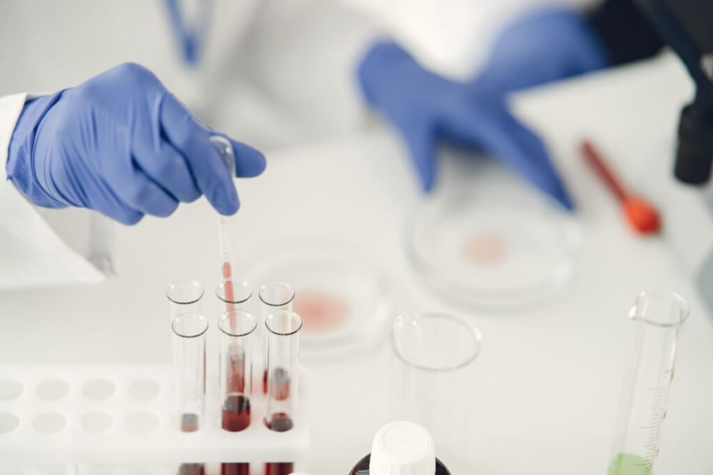 Lab technician using a pipette to prepare samples for cannabinoid potency testing