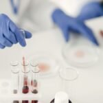 Lab technician using a pipette to prepare samples for cannabinoid potency testing