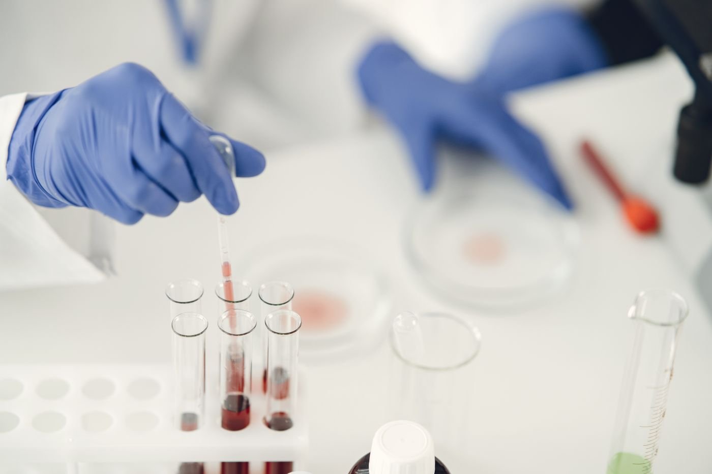 Lab technician using a pipette to prepare samples for cannabinoid potency testing