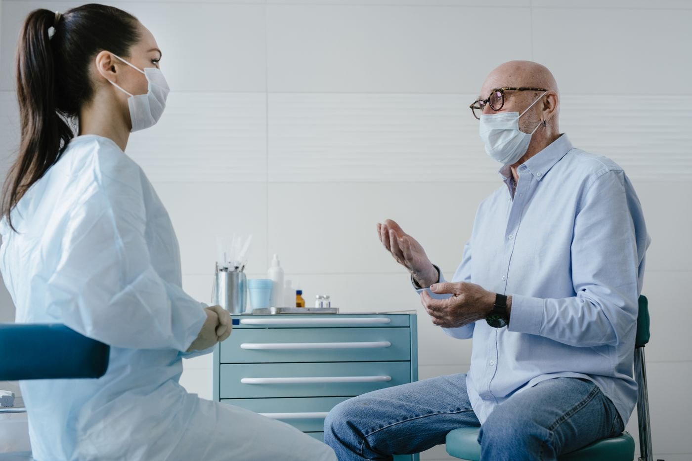 Older patient talking with a clinician during a medical appointment