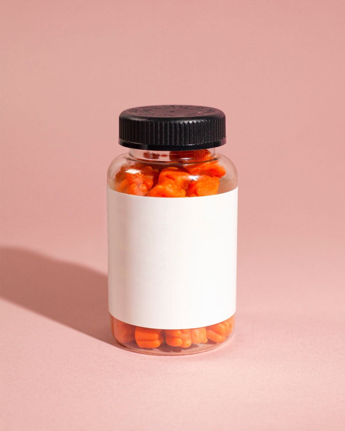 Bottle of hemp gummies on a pink background, viaHEMP Hemp Gummies review for Canada